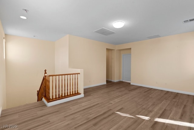 spare room featuring light hardwood / wood-style floors