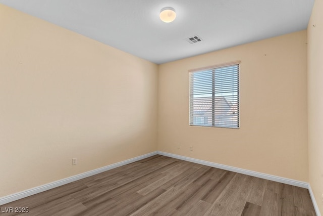 empty room with light hardwood / wood-style floors