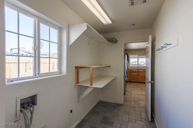 laundry area featuring sink and washer hookup