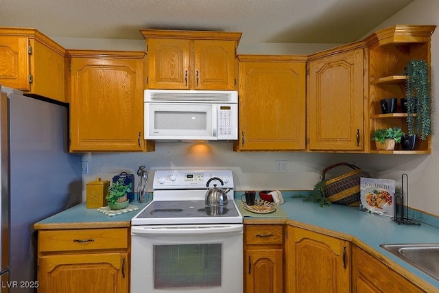 kitchen featuring sink and white appliances