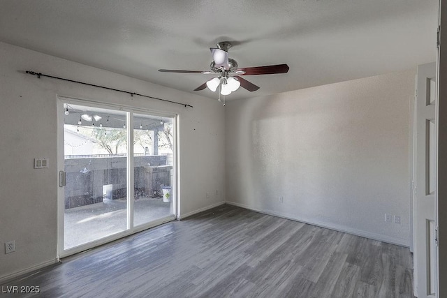 unfurnished room featuring hardwood / wood-style flooring and ceiling fan