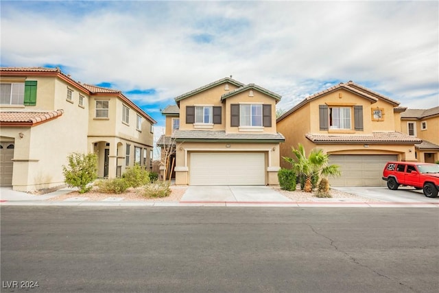 view of front of property with a garage