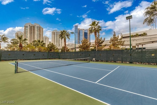 view of tennis court featuring basketball court