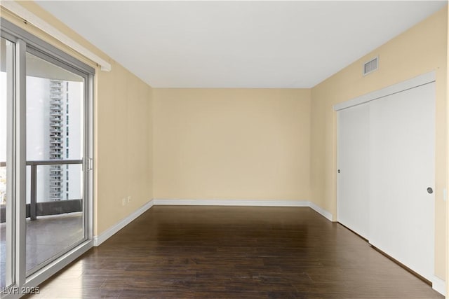 empty room featuring hardwood / wood-style floors