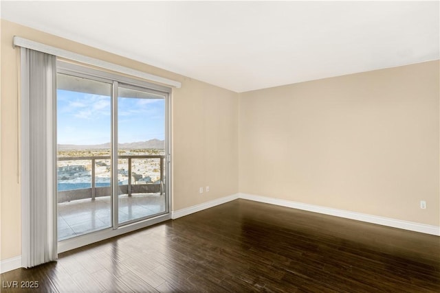 empty room with dark wood-type flooring