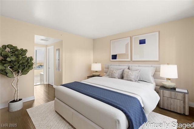 bedroom featuring dark hardwood / wood-style floors