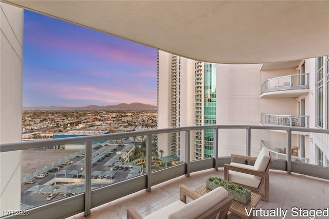 balcony at dusk with a mountain view