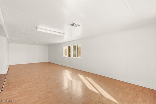 unfurnished room with light wood-type flooring