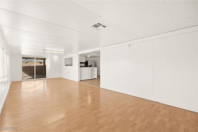 unfurnished living room with light wood-type flooring