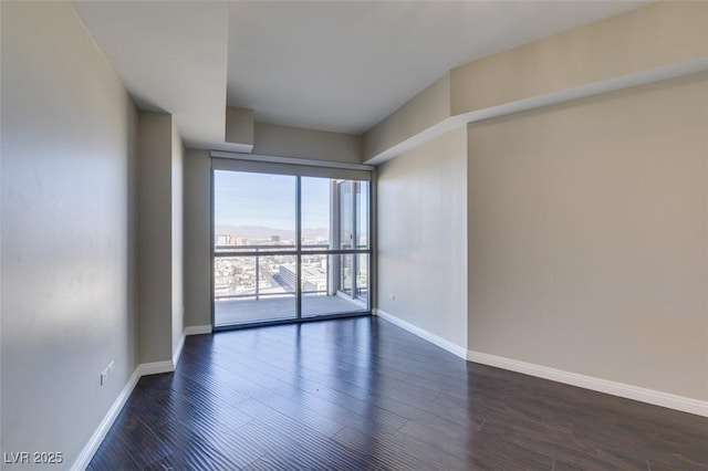 spare room featuring dark hardwood / wood-style floors