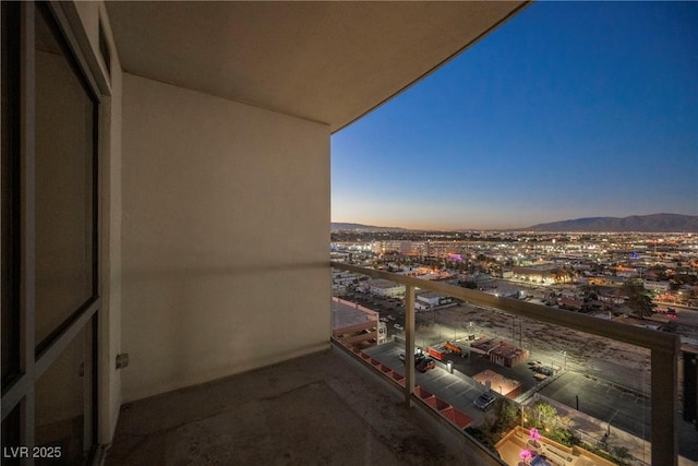 balcony at dusk with a mountain view