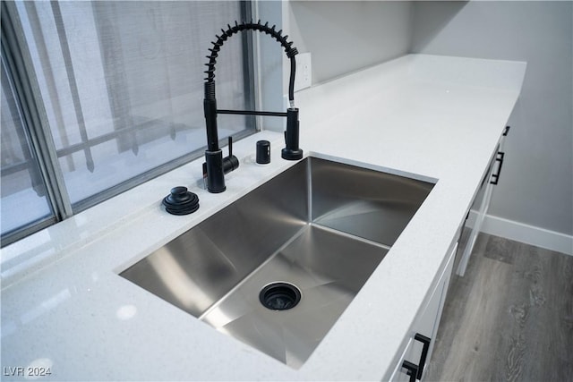 interior details featuring hardwood / wood-style floors and sink