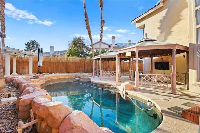 view of swimming pool with a gazebo and a patio