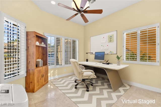 office with ceiling fan and light tile patterned floors