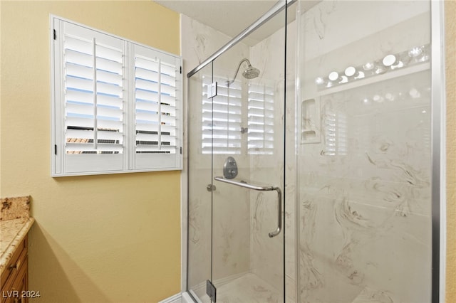 bathroom featuring vanity and walk in shower