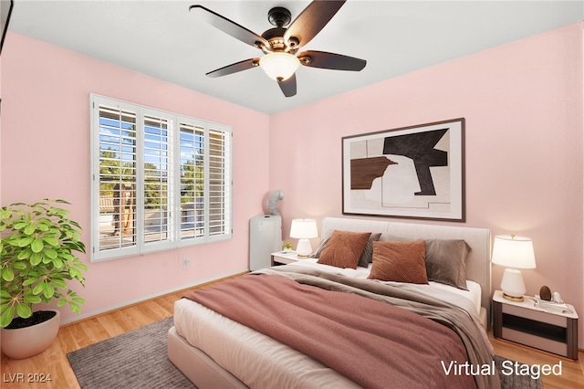 bedroom featuring light hardwood / wood-style flooring and ceiling fan