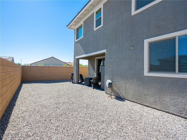 back of property featuring a patio