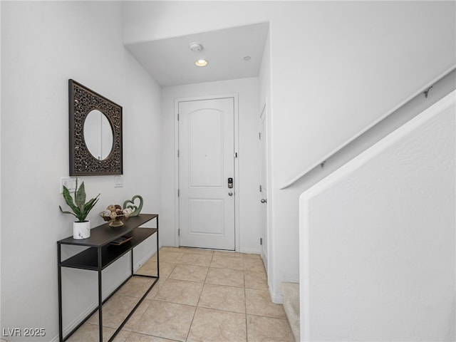 doorway to outside featuring light tile patterned floors