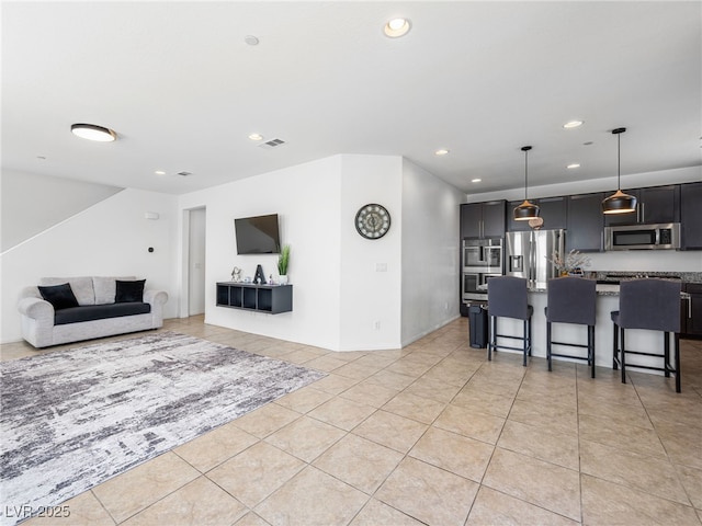 living room with light tile patterned flooring