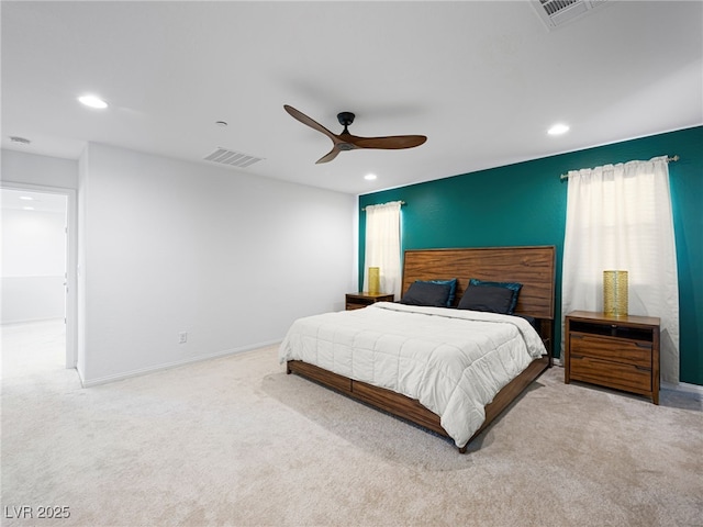 carpeted bedroom featuring multiple windows and ceiling fan