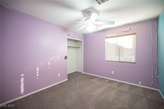 unfurnished bedroom with carpet, a closet, and ceiling fan