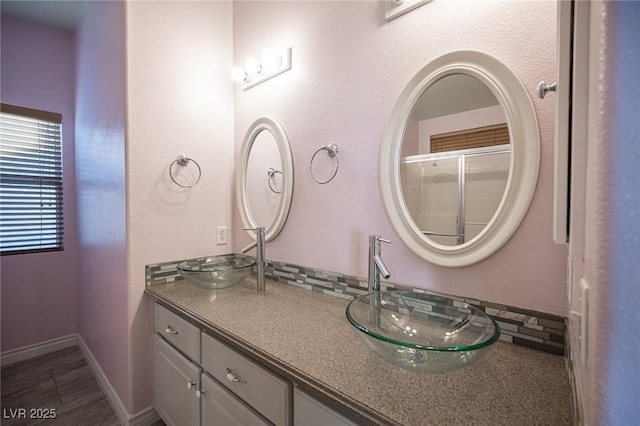 bathroom featuring tile patterned floors and vanity