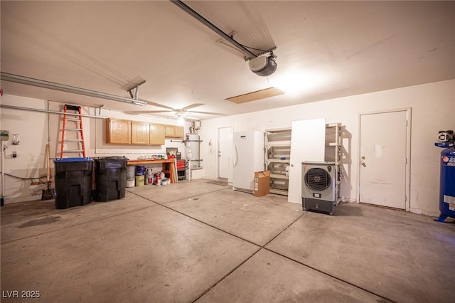 garage featuring secured water heater, white fridge, and a garage door opener