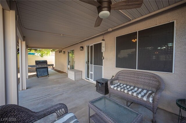 view of patio / terrace featuring ceiling fan and an outdoor living space