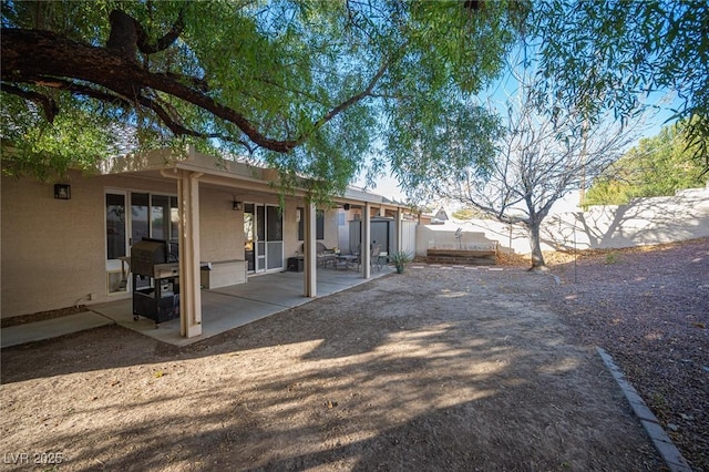 back of property with a patio area