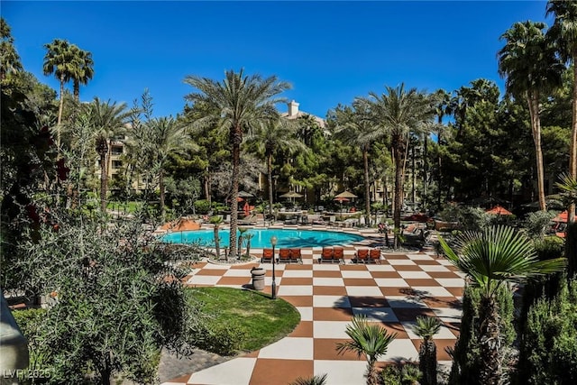 community pool featuring a patio area