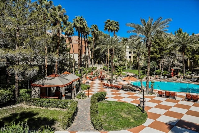 pool with a gazebo and a patio area