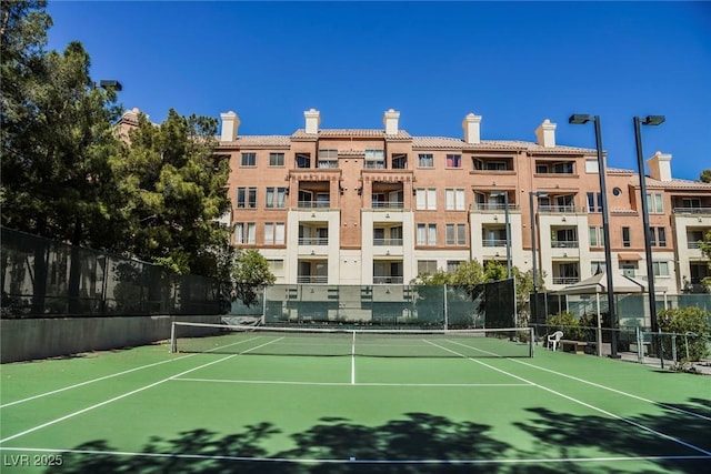 view of sport court with fence