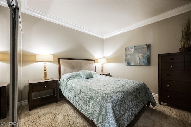 carpeted bedroom featuring ornamental molding and baseboards