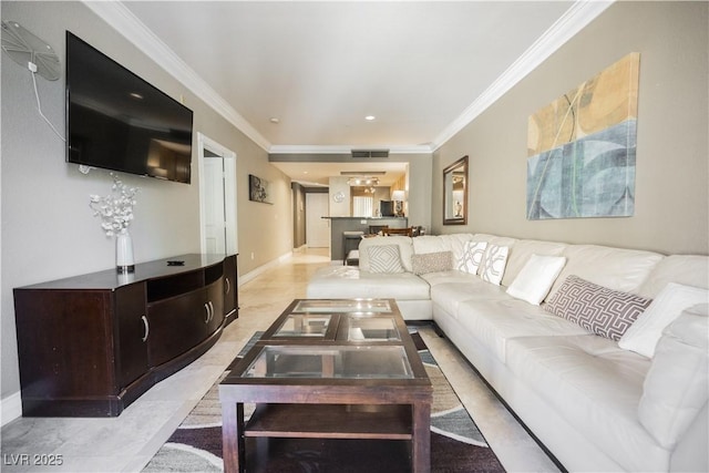 living area with ornamental molding, visible vents, and baseboards