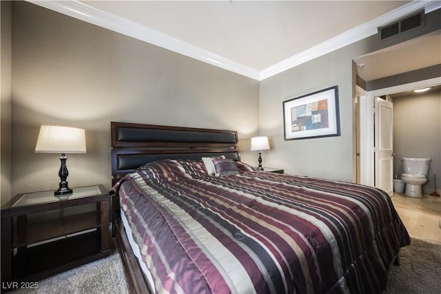 bedroom featuring ensuite bath, carpet, visible vents, and crown molding