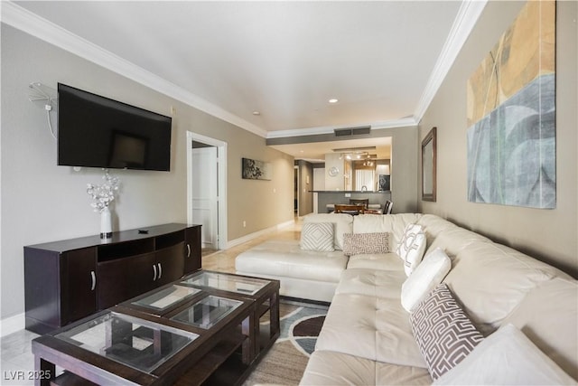 living room with baseboards, visible vents, and ornamental molding