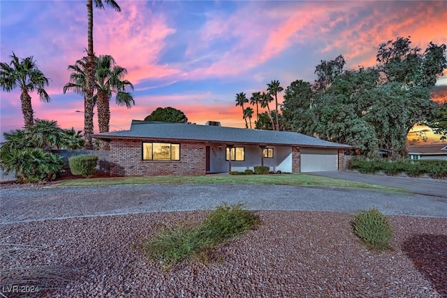 single story home featuring a garage