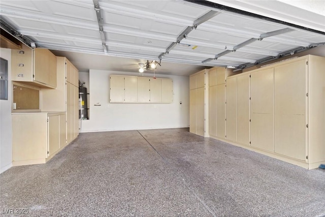 garage featuring secured water heater and a garage door opener