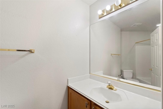 full bathroom with bathing tub / shower combination, vanity, and toilet