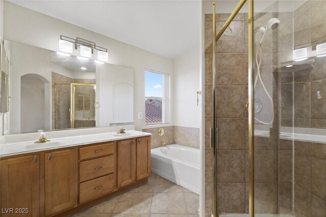 bathroom featuring tile patterned flooring, vanity, and separate shower and tub