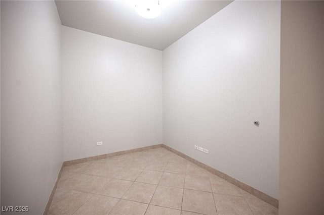 spare room featuring light tile patterned floors