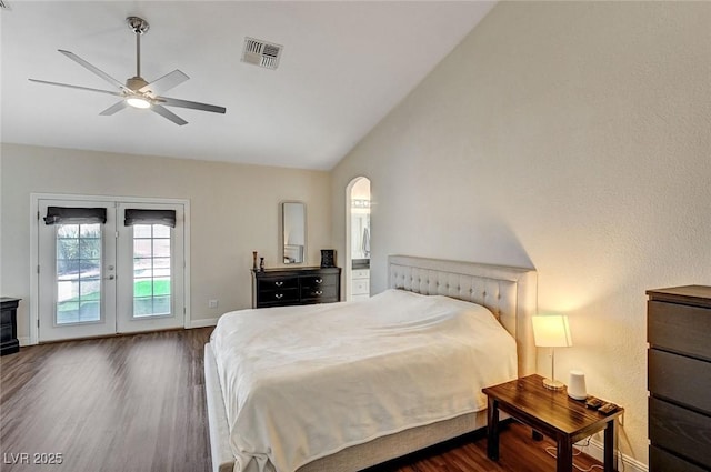 bedroom with access to outside, french doors, vaulted ceiling, ceiling fan, and dark hardwood / wood-style floors