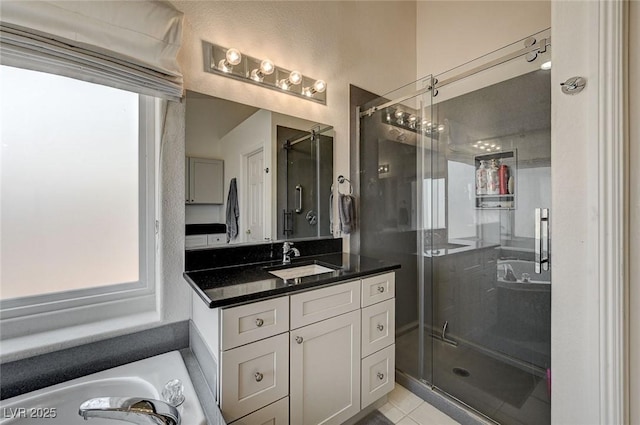 bathroom with vanity, tile patterned floors, and a shower with shower door