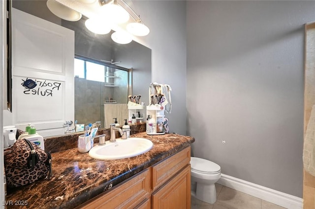 bathroom featuring tile patterned flooring, vanity, toilet, and a shower with shower door