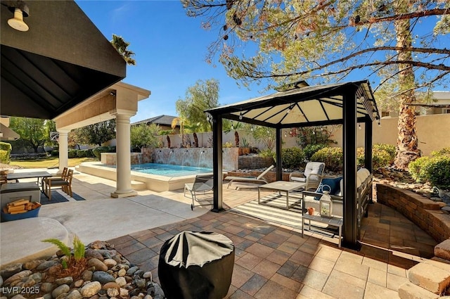 view of patio with a gazebo and pool water feature