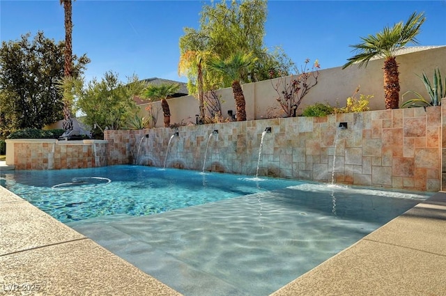 view of pool with pool water feature