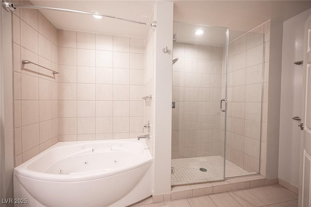 bathroom with shower with separate bathtub and tile patterned floors