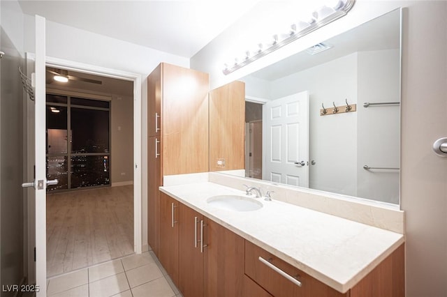 bathroom with tile patterned floors and vanity