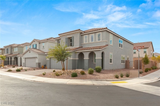 mediterranean / spanish-style home with a garage