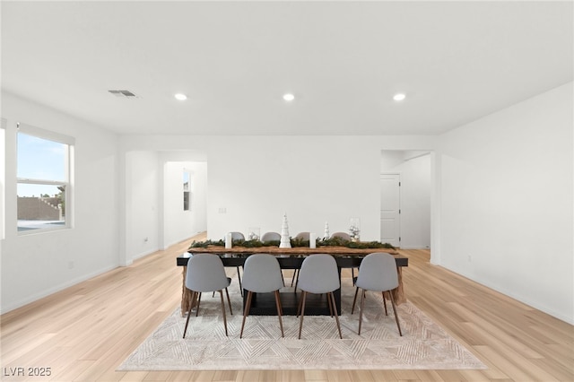 dining area with light hardwood / wood-style flooring